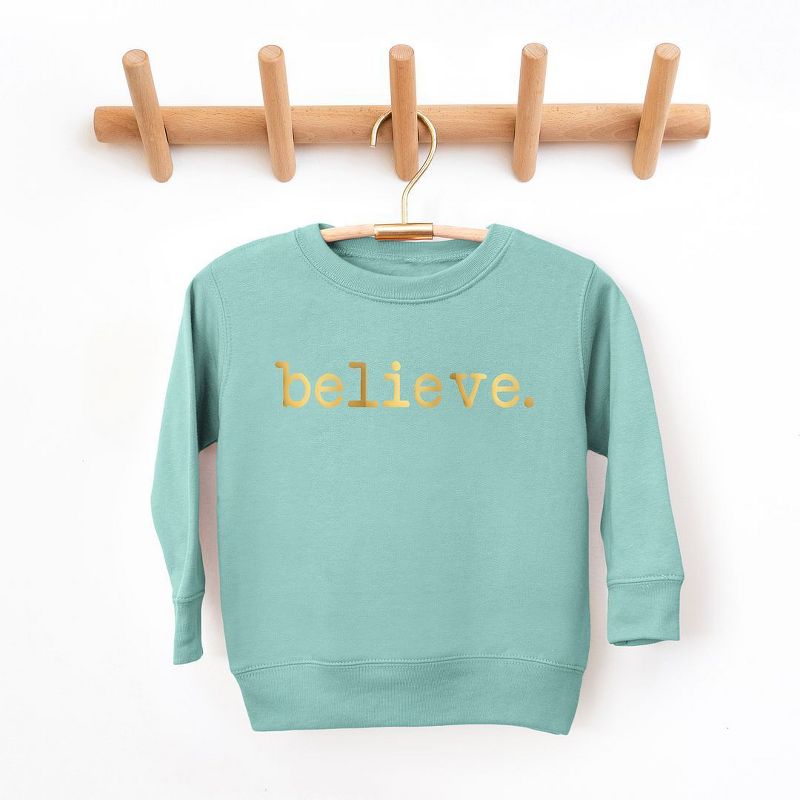 سويت شيرت جرافيكي ناعم للغاية مطبوع عليه Believe Puff من The Juniper Shop للشباب