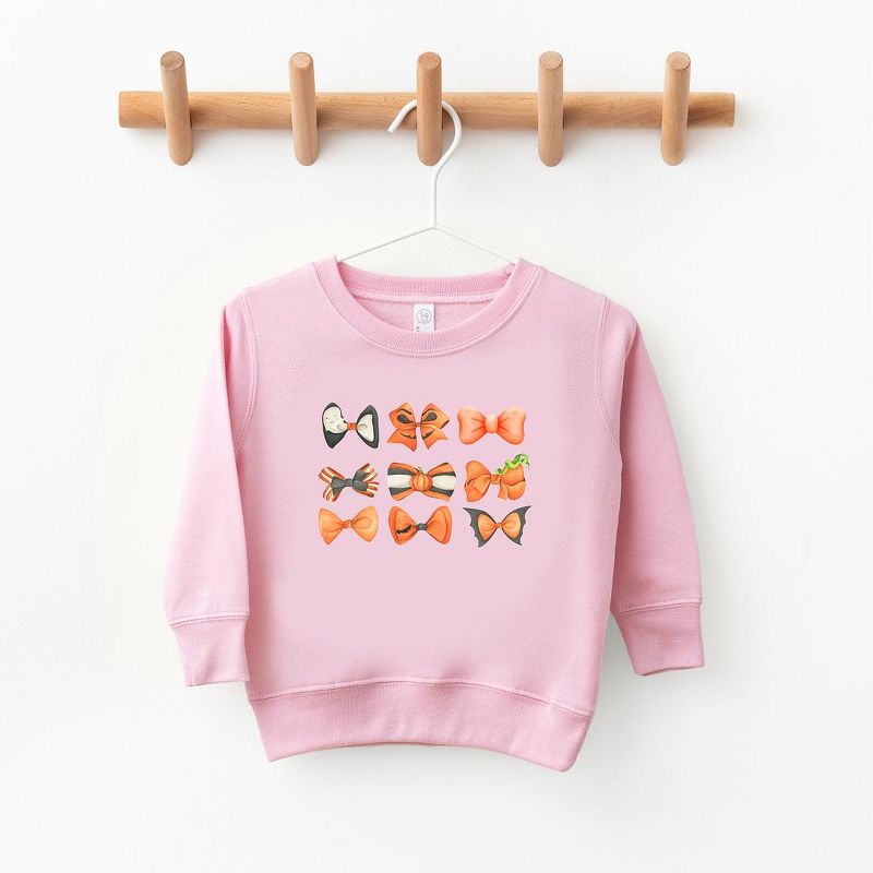 The Juniper Shop Coquette Girl Halloween Bow Chart Toddler Graphic Sweatshirt