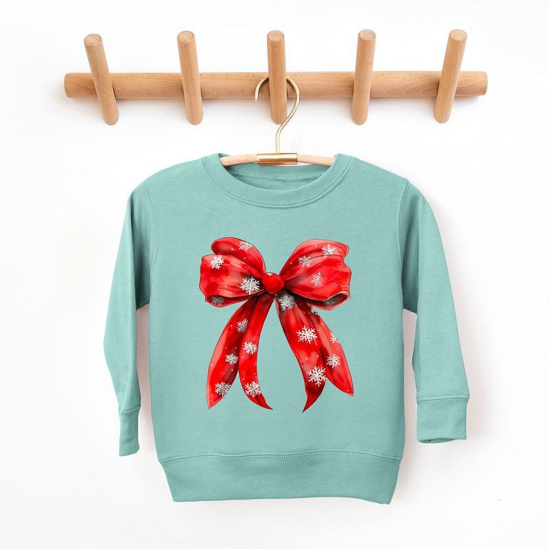 سويت شيرت جرافيكي ناعم للغاية للشباب من Juniper Shop Coquette Christmas Snowflake Bow