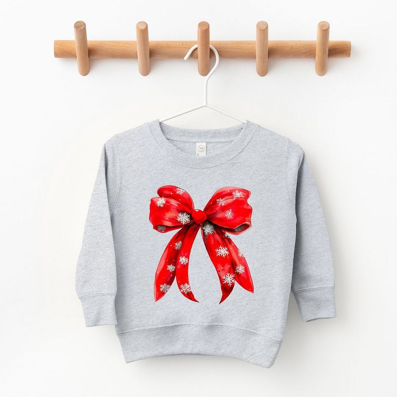 سويت شيرت جرافيكي ناعم للغاية للشباب من Juniper Shop Coquette Christmas Snowflake Bow