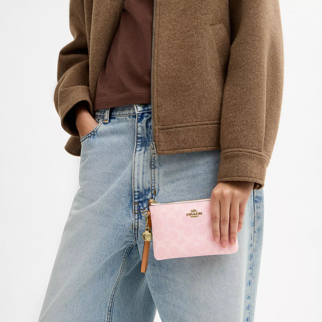 corner zip wristlet in signature canvas with charms
