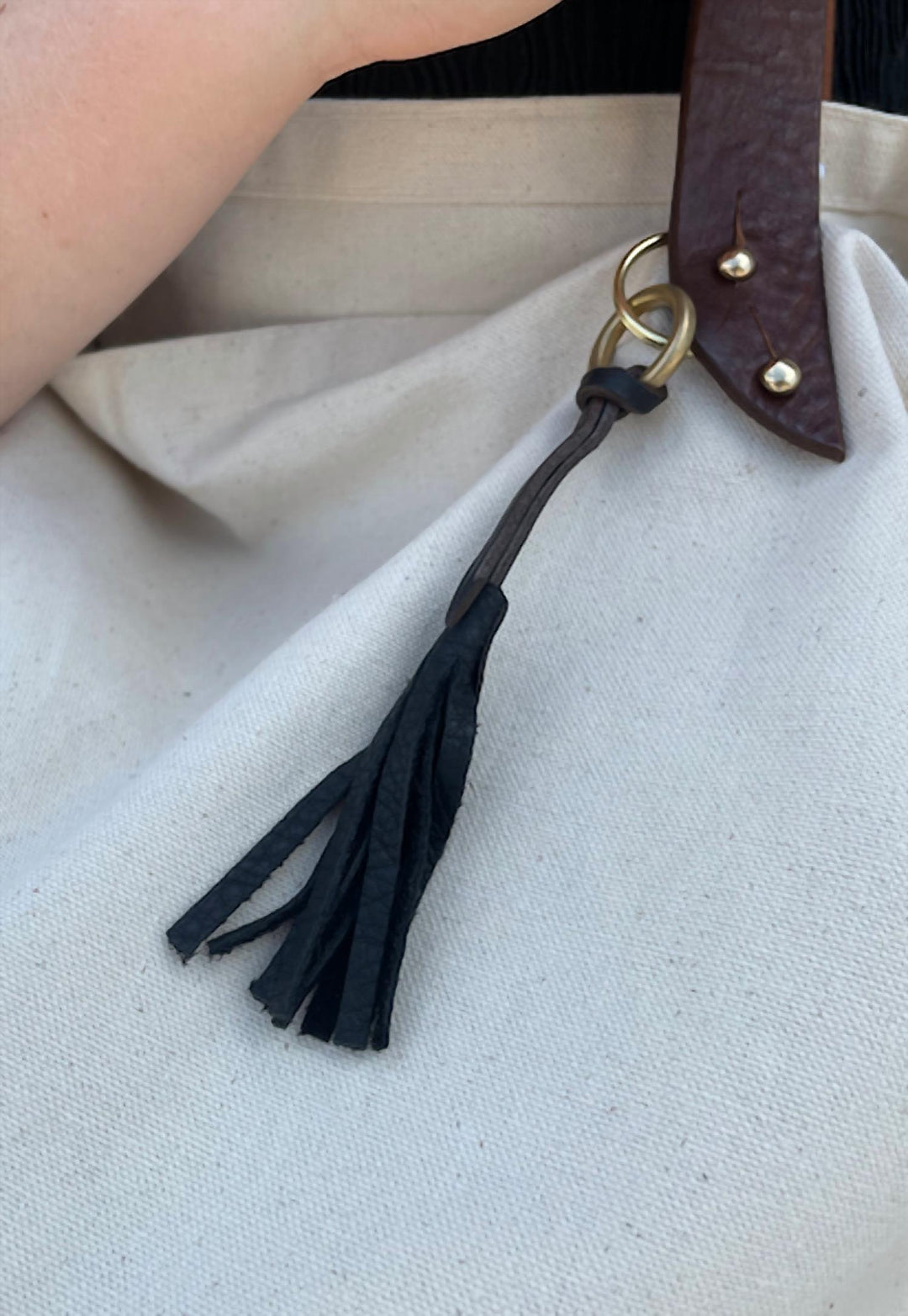 hand stitched leather tassel in black