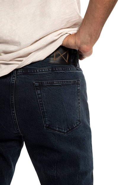 washed slim fit jeans in dark indigo