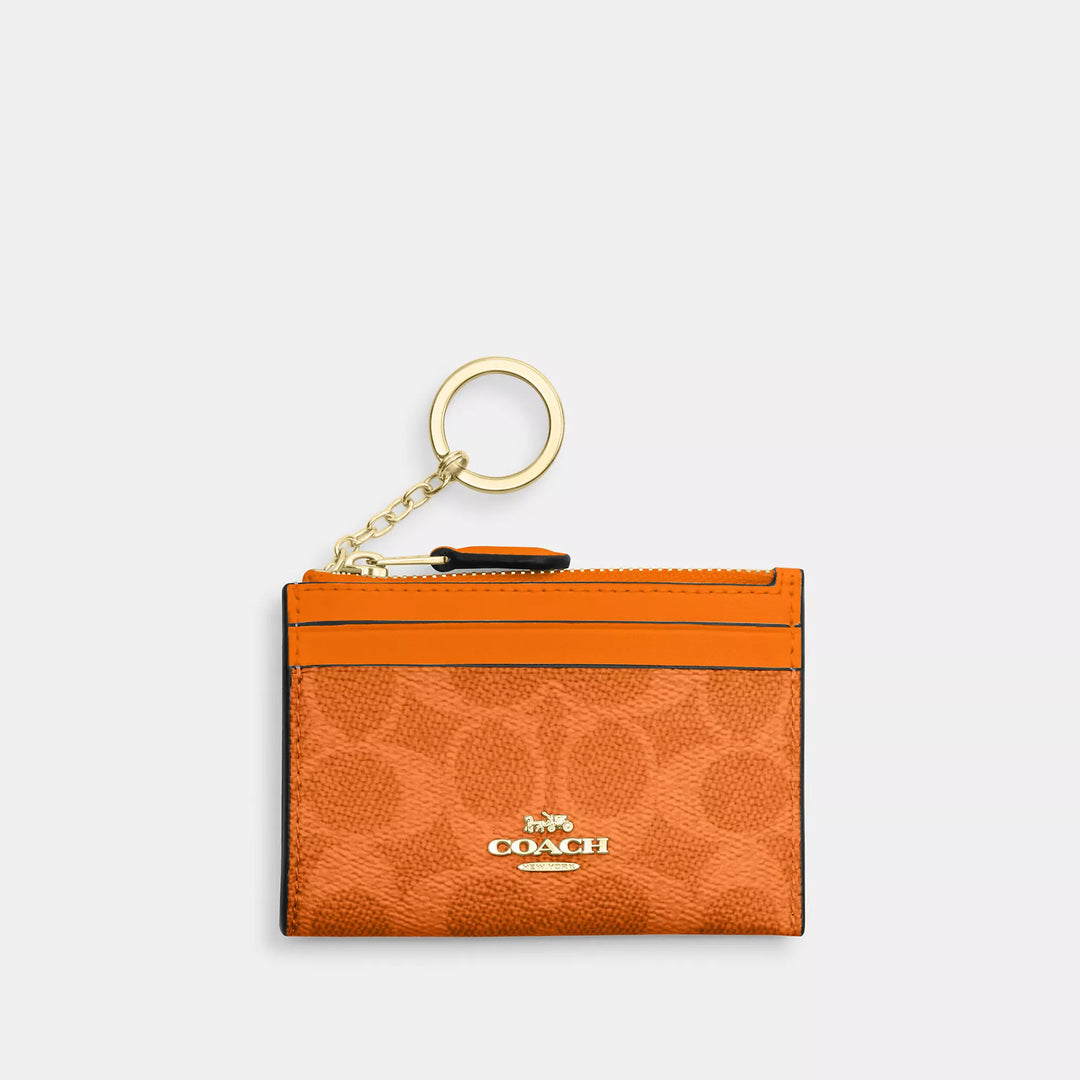 mini skinny id case in signature canvas