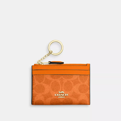 mini skinny id case in signature canvas