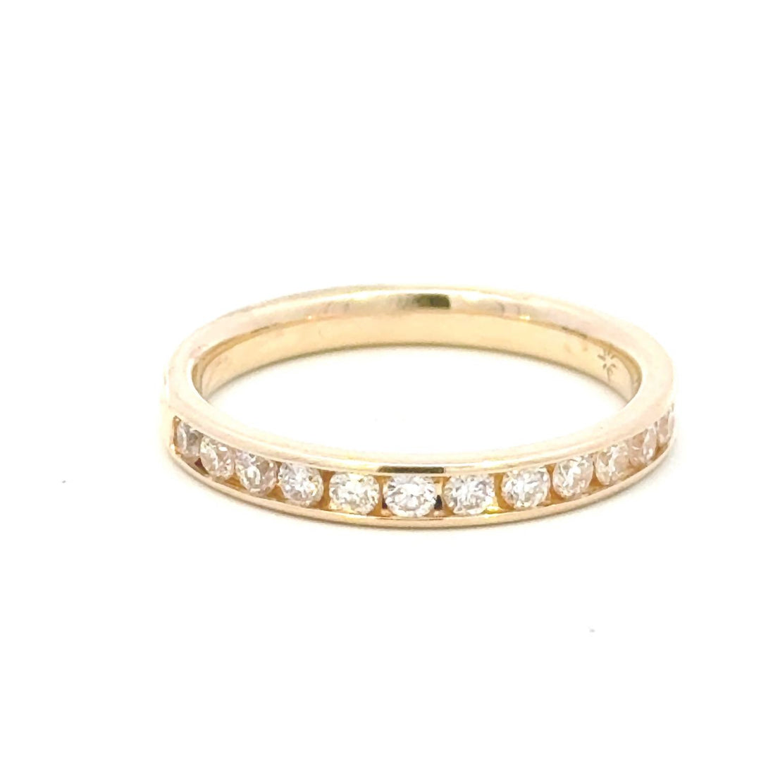 0.52 carat natural diamond round brilliant channel band - size 6.5 in 14k yellow gold