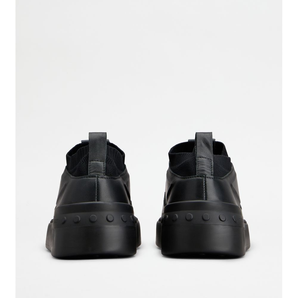 no_code x in leather and technical fabric