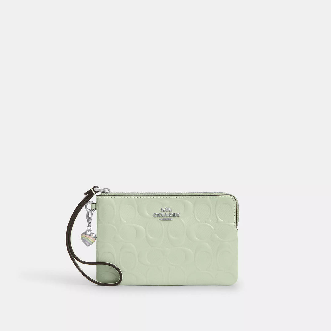 corner zip wristlet in signature leather with heart charm