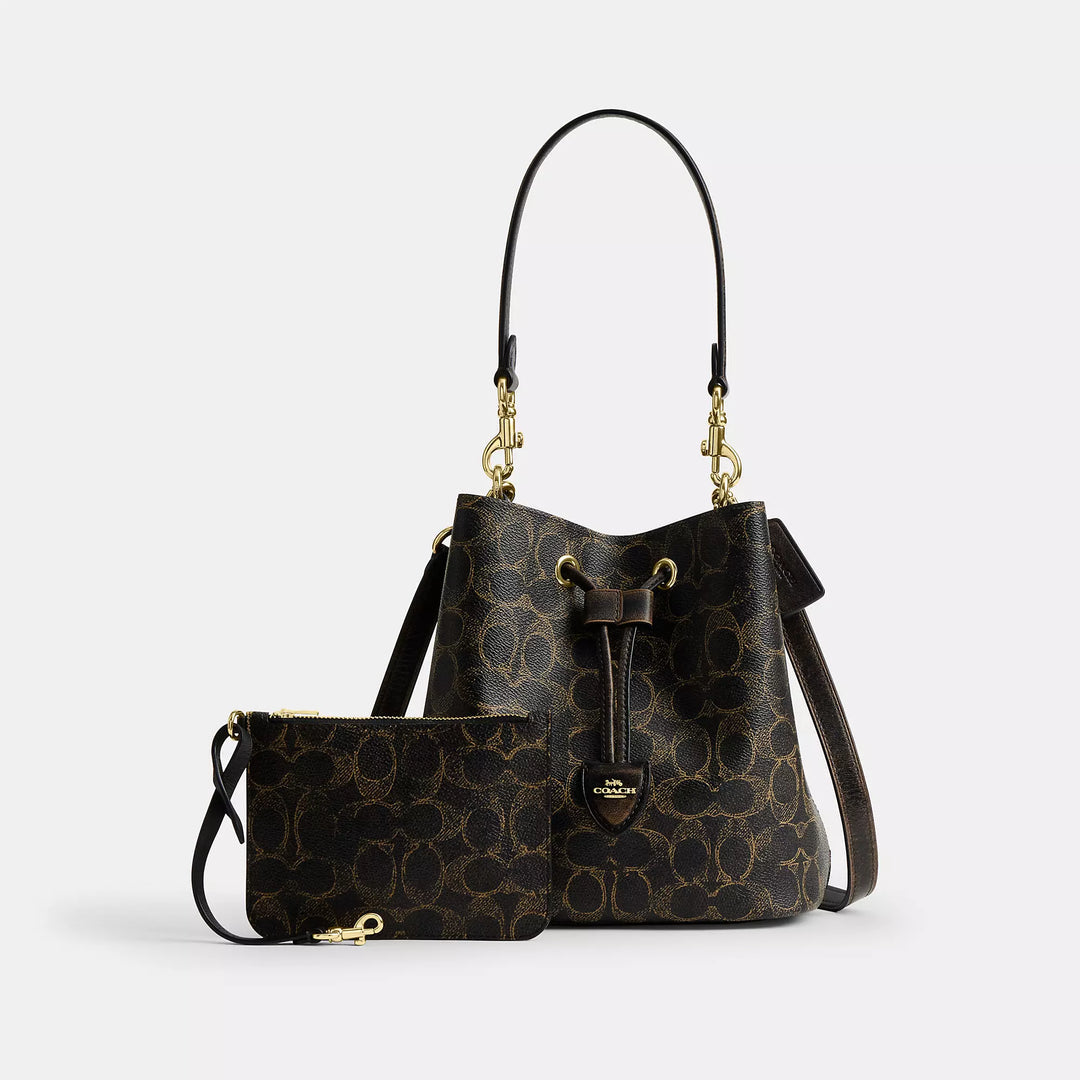 rowan bucket bag in loved signature canvas with charms