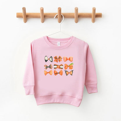 The Juniper Shop Coquette Girl Halloween Bow Chart Toddler Graphic Sweatshirt