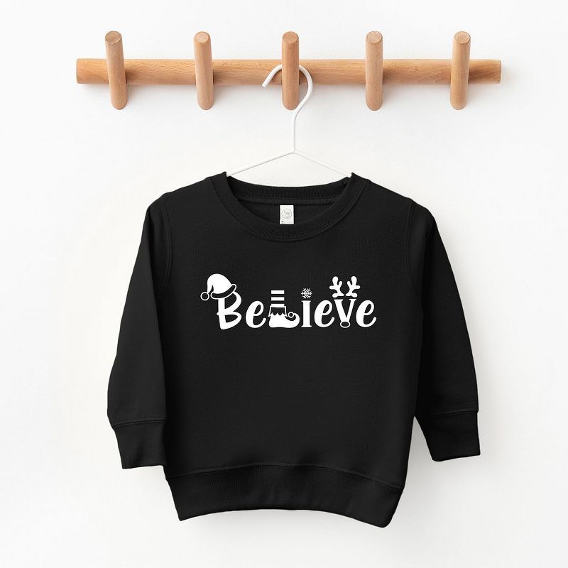The Juniper Shop Believe Christmas Toddler Graphic Sweatshirt