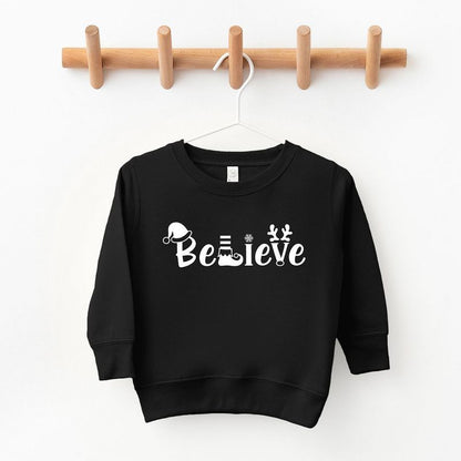 The Juniper Shop Believe Christmas Toddler Graphic Sweatshirt