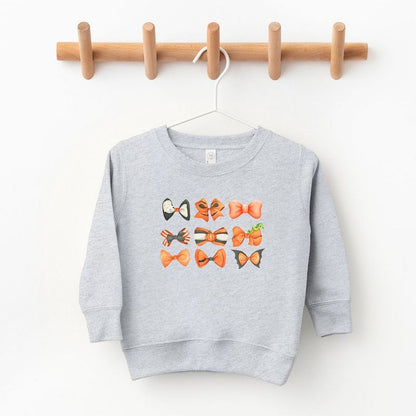 The Juniper Shop Coquette Girl Halloween Bow Chart Toddler Graphic Sweatshirt