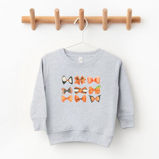 The Juniper Shop Coquette Girl Halloween Bow Chart Toddler Graphic Sweatshirt