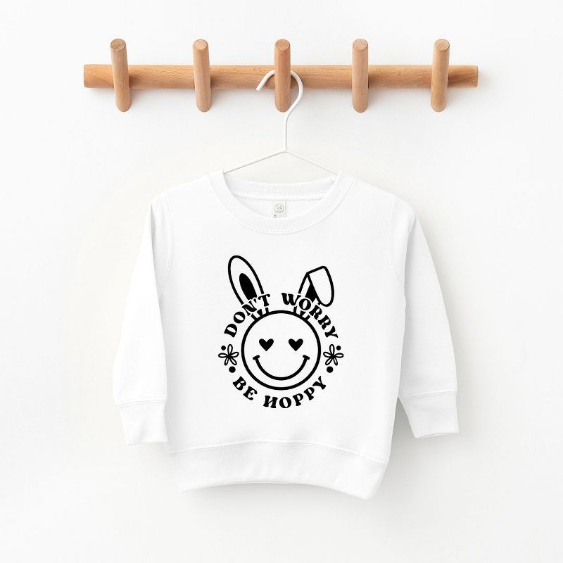 The Juniper Shop Don't Worry Be Hoppy Smiley Bunny Toddler Graphic Sweatshirt