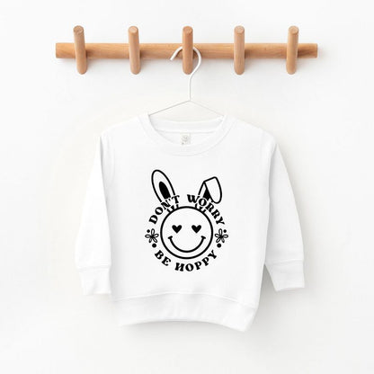 The Juniper Shop Don't Worry Be Hoppy Smiley Bunny Toddler Graphic Sweatshirt