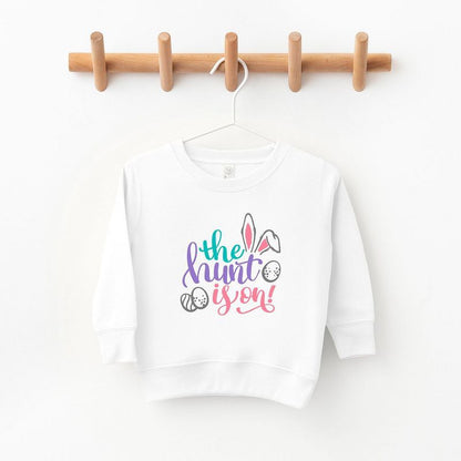 The Juniper Shop The Hunt Is On Easter Toddler Graphic Sweatshirt