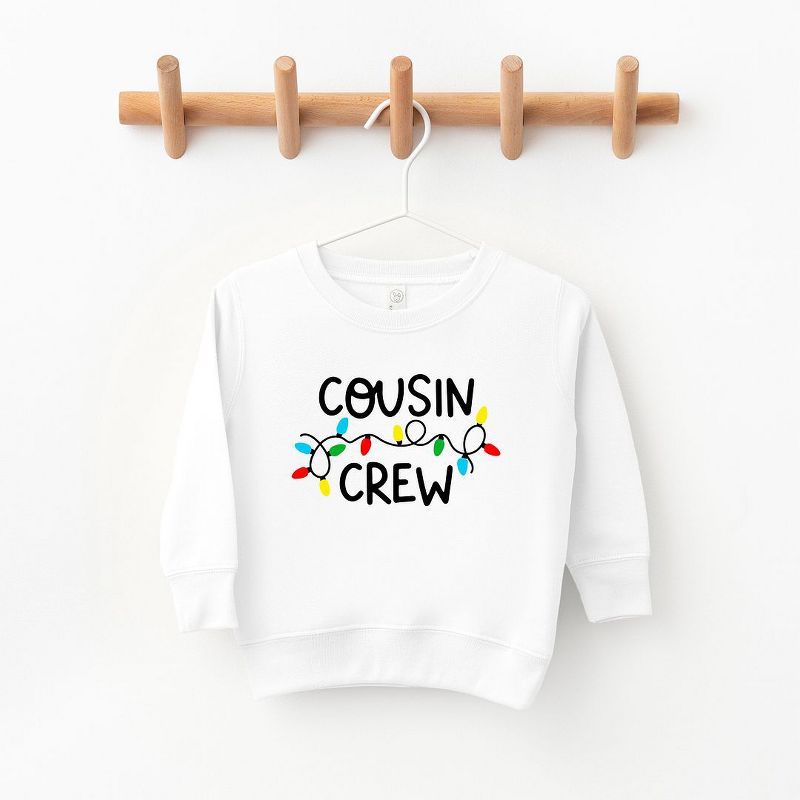 The Juniper Shop Cousin Crew Lights Toddler Graphic Sweatshirt