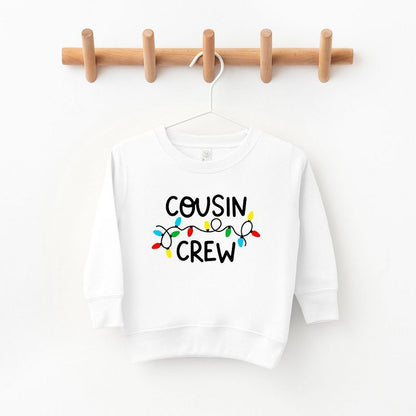 The Juniper Shop Cousin Crew Lights Toddler Graphic Sweatshirt