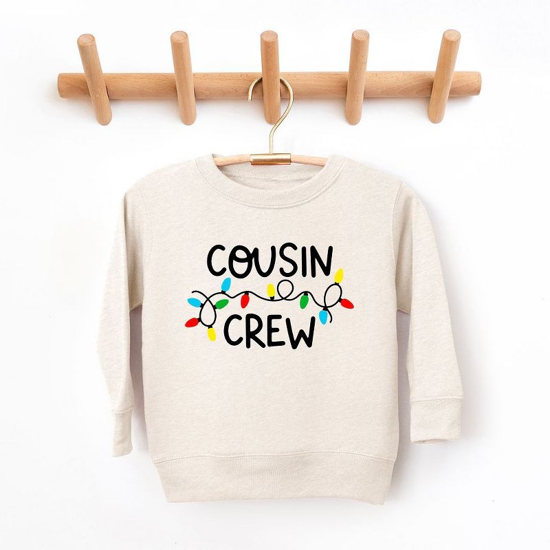 The Juniper Shop Cousin Crew Lights Toddler Graphic Sweatshirt