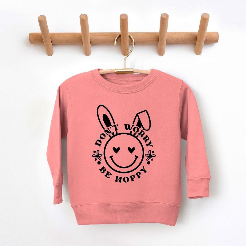 The Juniper Shop Don't Worry Be Hoppy Smiley Bunny Toddler Graphic Sweatshirt