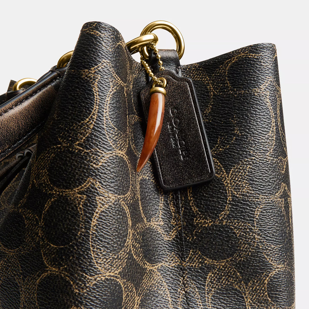 rowan bucket bag in loved signature canvas with charms