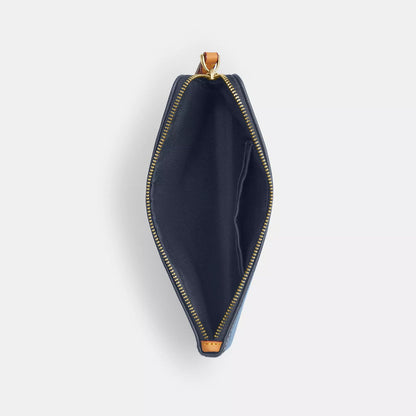 large corner zip wristlet in signature denim