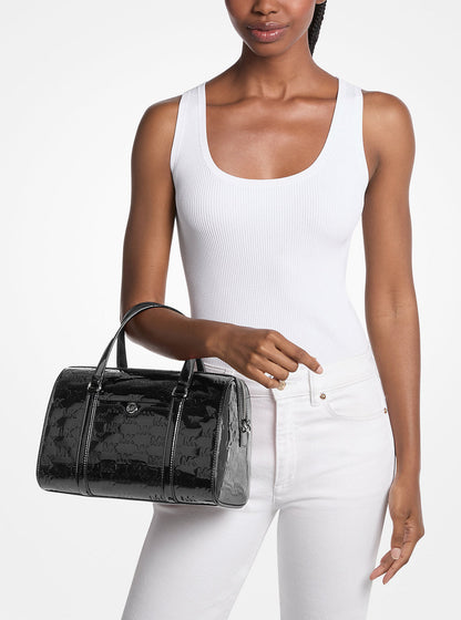 jet set medium patent logo debossed duffel crossbody bag