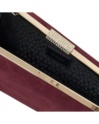 balancing suede clutch