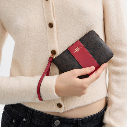 corner zip wristlet in signature canvas with stripe