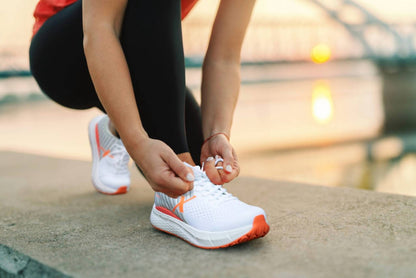 women's steadfast running shoes in white/coral