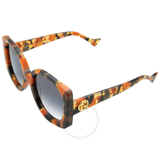 نظارات شمسية نسائية من غوتشي بتصميم فراشة متدرجة اللون باللون الأزرق